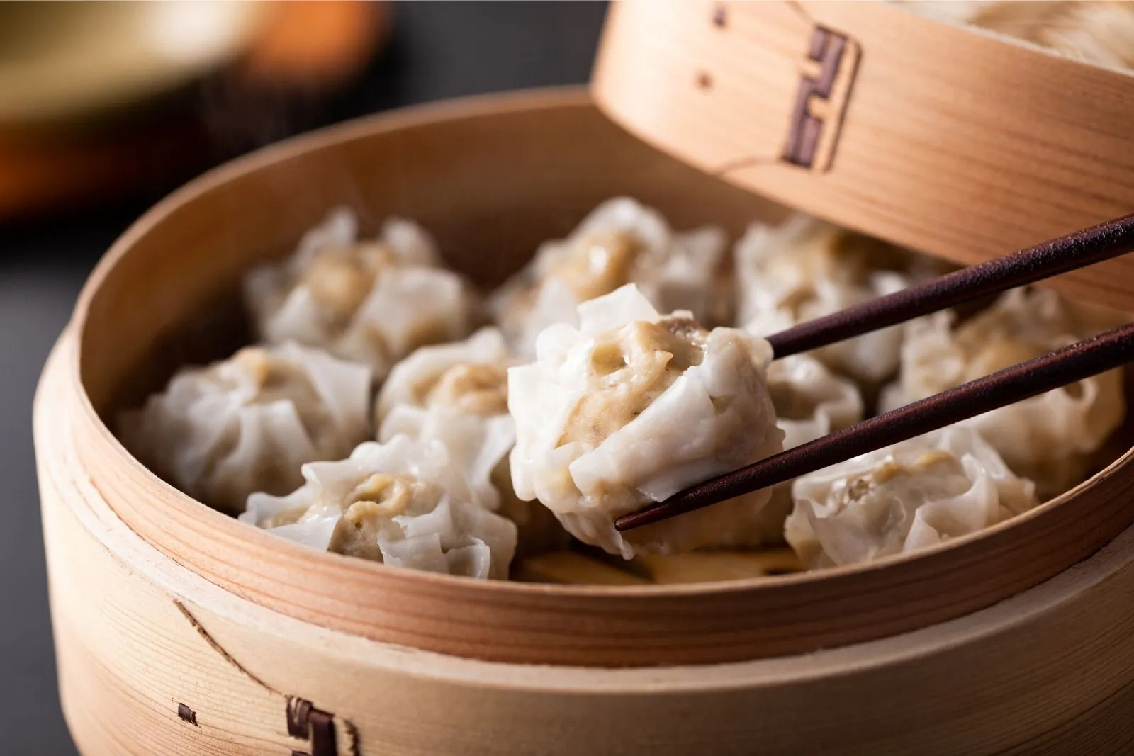 Steamed shrimp dumplings (siu mai) in bamboo steamer at Dumpling Bay, a Chinese Restaurant in Golden